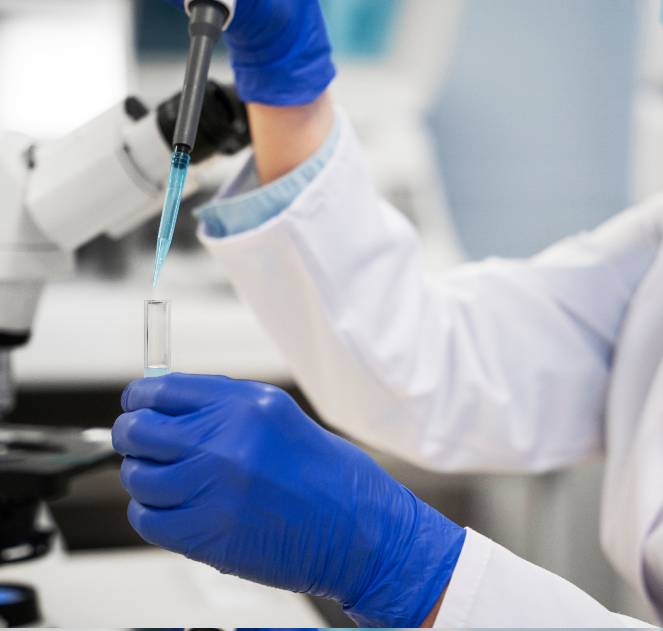 Laboratory professional pipetting a sample